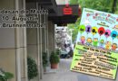 Beitragsbild mit einem Teil der Brunnenstraße v.a der Stadtparkasse und dem Plakat des Festivals